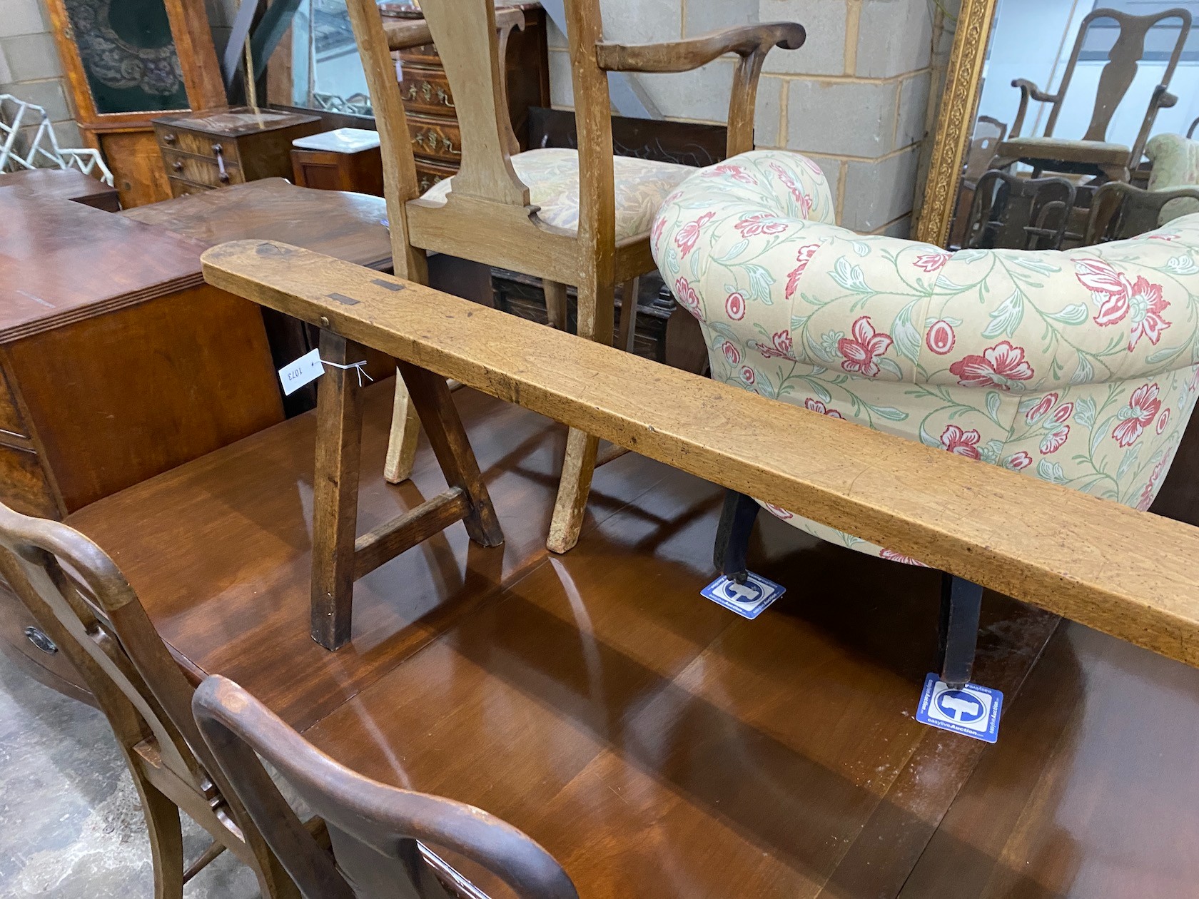 A late 18th / early 19th century provincial fruitwood bench seat, length 254cm, height 46cm